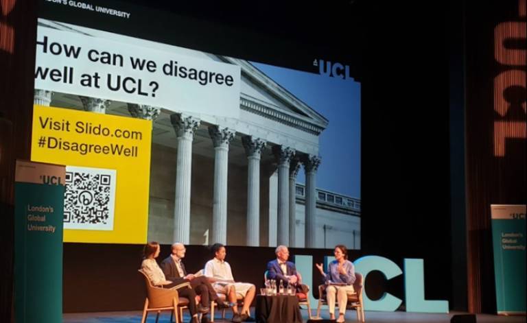 An image from the event titled: Disagreeing Well at MyAV. The photo contains 5 panellists sat on chairs on the Bloomsbury Theatre stage.